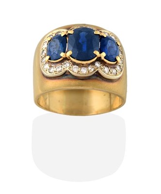 Lot 2188 - A Sapphire and Diamond Triple Cluster Ring, three graduated oval cut sapphires within a border...