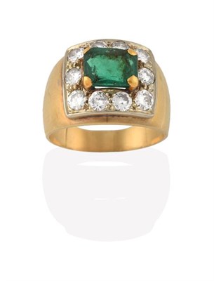 Lot 2191 - An Emerald and Diamond Cluster Ring, the emerald-cut emerald within a border of round brilliant cut