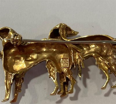 Lot 2192 - A Dog Brooch, realistically modelled as two standing dogs, with yellow textured hair and a...