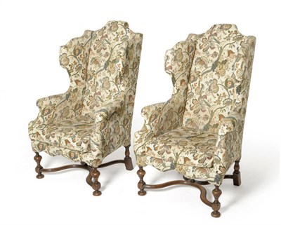 Lot 1712 - A Pair of Early Georgian Style Wing Back Chairs, upholstered in modern green floral fabric,...