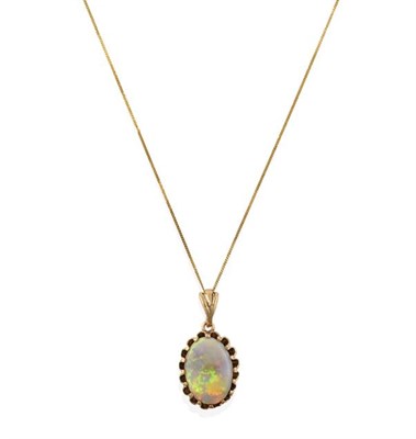 Lot 2196 - A 9 Carat Gold Opal Pendant on Chain, the oval opal in a yellow claw setting, on a fine trace...