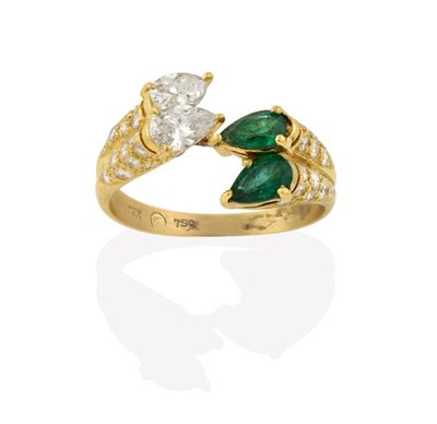 Lot 2200 - An Emerald and Diamond Ring, pairs of pear shaped emeralds and pear shaped diamonds, in a twist...