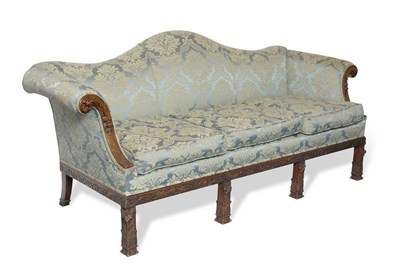 Lot 1713 - A Carved Mahogany Camel Back Settee, in the manner of William Vile, upholstered in blue and...