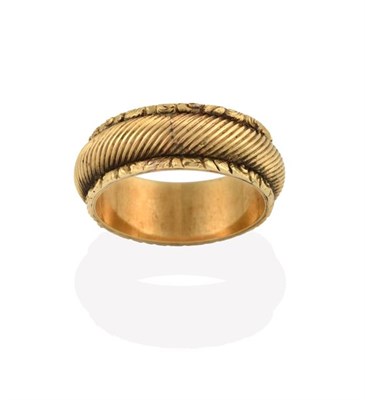 Lot 2211 - A Victorian Band Ring, the yellow textured band with an uneven border, finger size Q see...