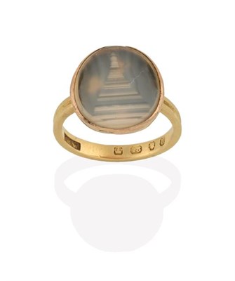 Lot 2213 - An 18 Carat Gold Victorian Agate Ring, the oval banded grey agate plaque depicting a stepped...