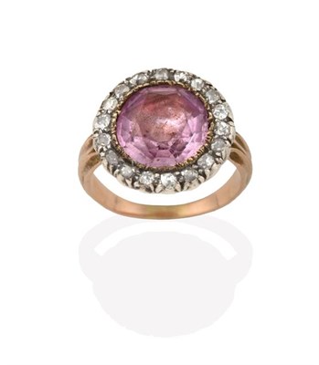 Lot 2214 - A Georgian Pink Topaz and Diamond Cluster Ring, the round cut pink topaz, in a yellow claw setting