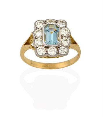 Lot 2218 - An Aquamarine and Diamond Cluster Ring, the emerald-cut aquamarine within a cluster of round...