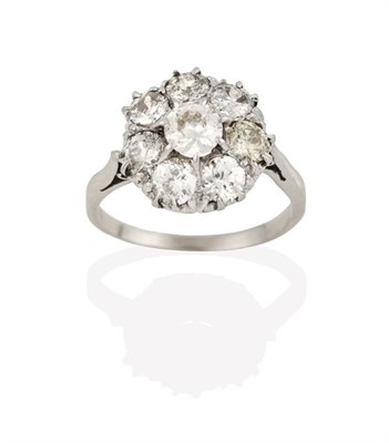 Lot 2241 - A Diamond Cluster Ring, the old cut diamond within a border of smaller old cut diamonds, in...