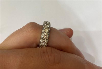 Lot 2243 - A Diamond Eternity Ring, fifteen round brilliant cut diamonds in white claw settings, total...