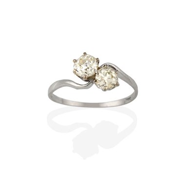 Lot 2250 - A Diamond Two Stone Twist Ring, the old cut diamonds in white claw settings, to a twist...