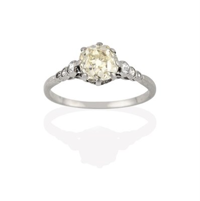 Lot 2252 - A Diamond Solitaire Ring, the old cut diamond in a white claw setting, to graduated old cut diamond
