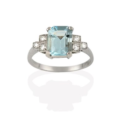 Lot 2253 - An Art Deco Style Aquamarine and Diamond Ring, the emerald-cut aquamarine in a white claw...
