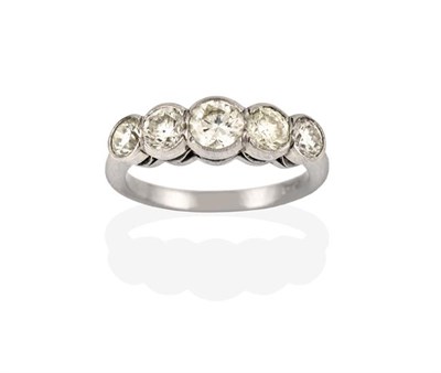 Lot 2258 - A Diamond Five Stone Ring, the graduated round brilliant cut diamonds in white rubbed over...