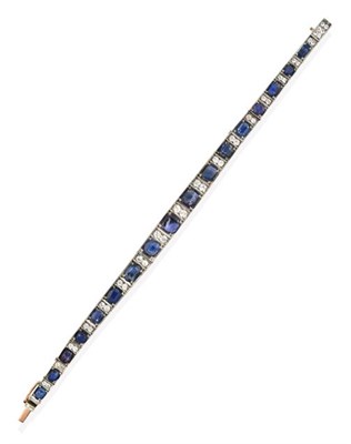 Lot 2263 - An Early 20th Century Sapphire Line Bracelet, seventeen vari-cut sapphires alternate with pairs...