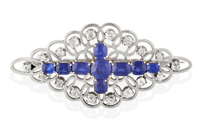 Lot 2275 - A Sapphire and Diamond Brooch, the vari-cut sapphires arranged in a cross formation, to a...