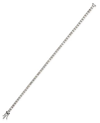 Lot 2287 - A Diamond Line Bracelet, the round brilliant cut diamonds in white four claw settings, total...