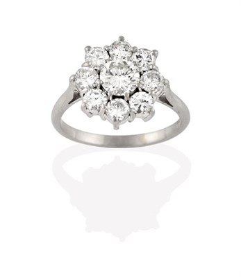 Lot 2288 - A Diamond Cluster Ring, the central round brilliant diamond within a border of smaller round...