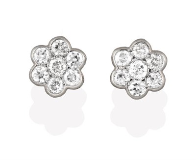 Lot 2289 - A Pair of Diamond Cluster Earrings, a round brilliant cut diamond within a border of smaller...