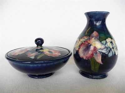 Lot 1728 - A Walter Moorcroft Orchid Pattern Bowl and Cover, circa 1949, on a blue ground, impressed facsimile