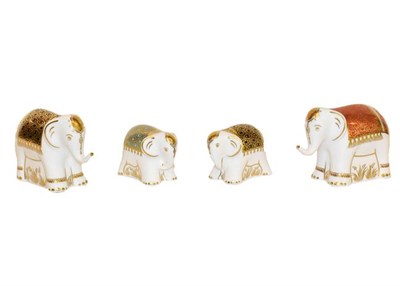 Lot 29 - Royal Crown Derby Paperweights: A group of six elephants all with gold stoppers, tallest 11cm
