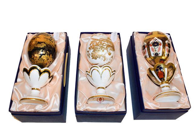 Lot 31 - Royal Crown Derby Fabergé Eggs: A group of six on stands including two commissioned by Wheelers of
