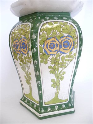 Lot 1738 - A Minton Hexagonal Garden Seat, decorated with stylised blue and yellow flowerheads and leaves...