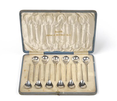 Lot 1772 - A Set of Twelve Keswick School of Industrial Arts Silver Tea Spoons, maker's mark KSIA, Chester...