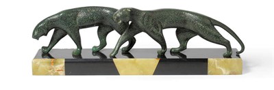 Lot 1785 - Michel Decoux: An Art Deco Patinated Bronze Group, modelled as two striding panthers, on a...