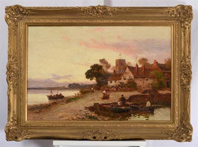 Lot 1042 - Walter Stuart Lloyd (1845-1959) Bringing in the catch at dusk  Fishing boats moored in a small...