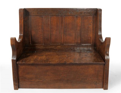 Lot 1794 - A 1930's Robert "Mouseman" Thompson Joined Oak Settle, the panelled back carved FERE GOD HONOUR THE