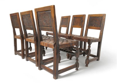 Lot 1795 - A Set of Six Robert "Mouseman" Thompson Burr Oak Panel Back Chairs, circa 1920's/30's, leather...