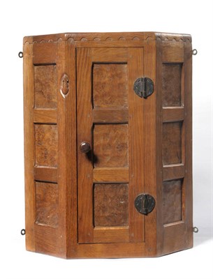 Lot 1796 - A Robert "Mouseman" Thompson Panelled Burr Oak Corner Cupboard, circa 1930's, of small proportions