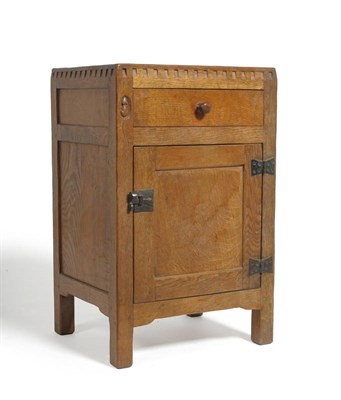 Lot 1799 - A 1930's Robert "Mouseman" Thompson Oak Bedside Cupboard, castellated frieze above a single drawer