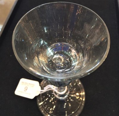 Lot 6 - A Cordial Glass, circa 1710, the wide conical bowl with basal air tear on an inverted baluster stem