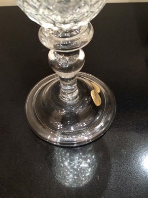 Lot 9 - A Glass Goblet, circa 1730, the rounded funnel bowl moulded with ''Nipt diamond waies'' on a triple