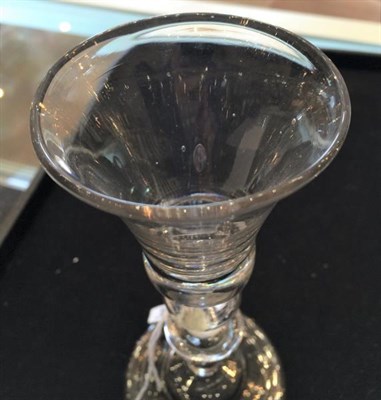 Lot 11 - A Wine Glass, circa 1730, the bell shaped bowl with air tear to solid base, on an inverted baluster
