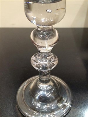 Lot 11 - A Wine Glass, circa 1730, the bell shaped bowl with air tear to solid base, on an inverted baluster