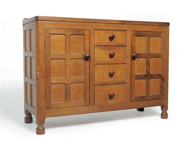 Lot 1802 - A Robert "Mouseman" Thompson Panelled Oak 4' Sideboard, with raised upstand above four central...