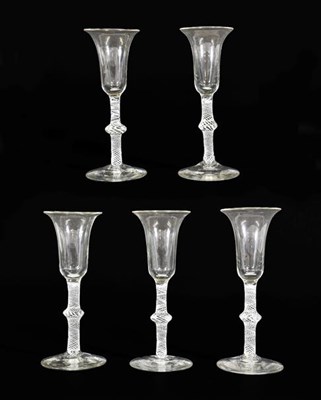Lot 20 - A Set of Five Wine Glasses, circa 1750, the bell shaped bowls on knopped opaque twist stems, 16.5cm