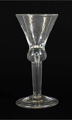 Lot 21 - A Wine Glass, circa 1750, the conical bowl on ball knop with air tear extending into plain stem...