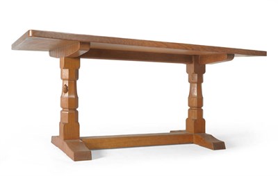 Lot 1803 - A Robert "Mouseman" Thompson Oak 5'6" Refectory Table, dowelled three plank top, on two...