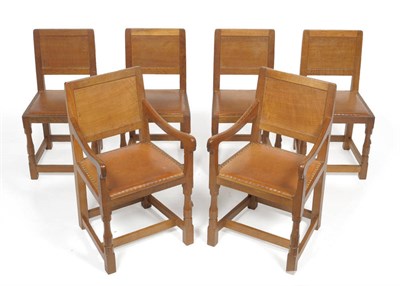 Lot 1804 - A Set of Six (4+2) Robert "Mouseman" Thompson Oak Panel Back Chairs, on turned octagonal front...