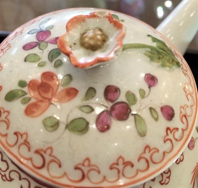 Lot 42 - A Lowestoft Porcelain Teapot and Cover, circa 1770, with floral moulded knop, painted in...