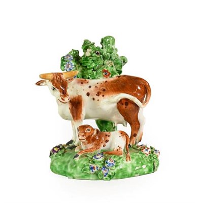 Lot 59 - A Matched Pair of Derby Porcelain Cow and Calf Groups, circa 1780, each on mound bases with bocage