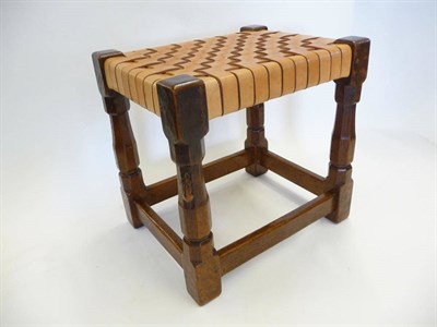 Lot 1807 - A Robert "Mouseman" Thompson Oak Stool, with lattice leather seat on four turned legs joined by...