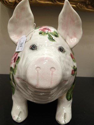 Lot 94 - A Wemyss Pottery Pig, early 20th century, naturalistically modelled seated, painted with pink...