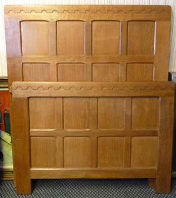 Lot 1811 - A Robert "Mouseman" Thompson Panelled Oak 3' Single Bedstead, with carved mouse signature