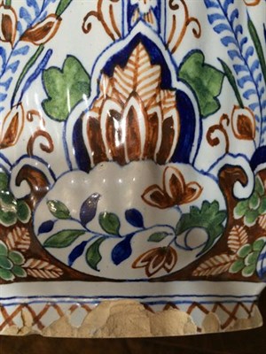 Lot 104 - A Delft Jar and Cover, in early 18th century style, of fluted octagonal baluster form, painted...