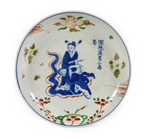 Lot 130 - A Chinese Porcelain Saucer Dish, 17th century, painted in underglaze blue and green, yellow and red