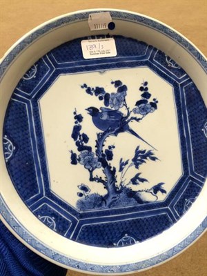 Lot 139 - A Chinese Porcelain Dish, Kangxi, of circular form, painted in underglaze blue with a bird...